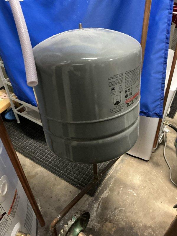 Responded to service call for hot water heating system with operational boiler of unknown age. Successfully replaced Amtrol Extrol EX-30 expansion tank on the hydronic heating system. The existing expansion tank was removed and the new EX-30 unit was installed with proper connections to the copper piping and pressure relief valve assembly. System was pressurized, tested for leaks, and verified operational with heat continuing to function properly throughout the building.