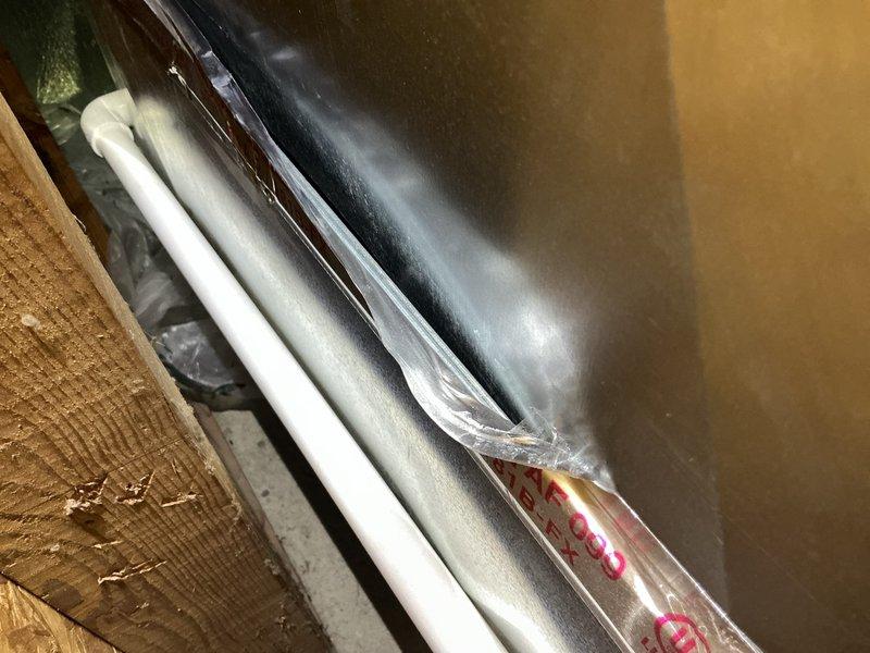 Responded to callback for 1-month-old AC unit in basement experiencing water leakage and unusual operational noises. Upon inspection, identified improperly installed condensate drain line and refrigerant line insulation issues causing moisture accumulation. Corrected drain line pitch, secured insulation wrapping on refrigerant lines, and verified proper system operation with no further leaks or abnormal sounds detected.
