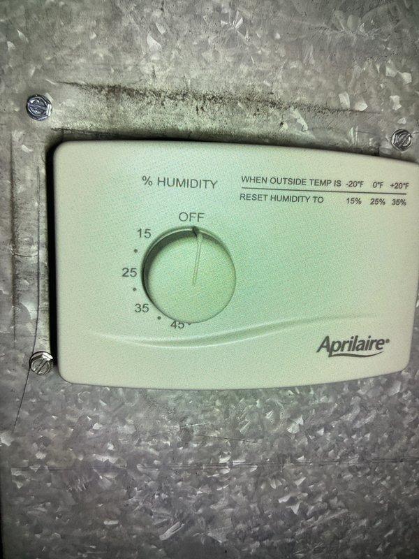 Completed comprehensive Gold AC Inspection on 4-year-old system with air handler located in basement. Performed full multi-point inspection including refrigerant levels, electrical connections, condensate drainage, and airflow measurements. Inspected Aprilaire humidity control system and noted accumulated dust on unit, indicating need for routine cleaning. Observed Rheem Professional Series water heater in mechanical room with dust accumulation on top of tank and copper piping connections. Advised homeowner that replacement air filters are needed for optimal system performance and efficiency.