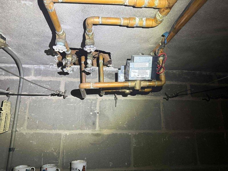 Responded to no heat call for 15-year-old furnace in basement that was continuously running and unable to shut off. Upon inspection, diagnosed faulty zone valve causing system to remain in constant heating mode. Removed defective zone valve from hydronic heating manifold assembly and replaced with new unit from inventory. Tested zone valve operation, verified proper electrical connections to control board, and confirmed system now cycles on and off correctly per thermostat demands. System restored to normal operation with proper temperature control.