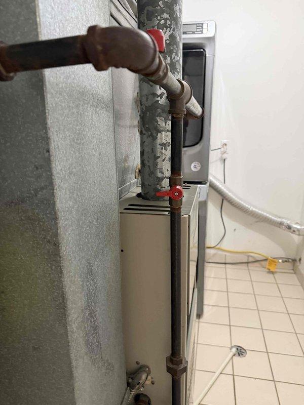 Performed city certification inspection on forced air furnace and water heater located on main level. Inspected gas valve assembly and pressure regulator on heating equipment, verifying proper operation and safety compliance. Examined all visible piping connections, gas lines, and mechanical components for leaks and proper installation. Verified equipment functionality and documented current condition of system components for certification purposes. All equipment met municipal safety standards and passed inspection requirements.