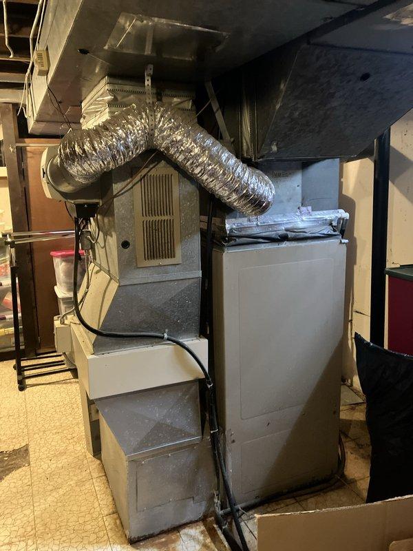 Completed full HVAC system replacement for residential property, removing existing air conditioning and furnace units that had exceeded their 10-year service life. Installed new high-efficiency furnace in basement utility area with proper venting and flexible ductwork connections to existing infrastructure. Mounted new outdoor condensing unit and established refrigerant lines between indoor and outdoor components. Verified all electrical connections, tested system operation across heating and cooling modes, and confirmed proper airflow through distribution system.