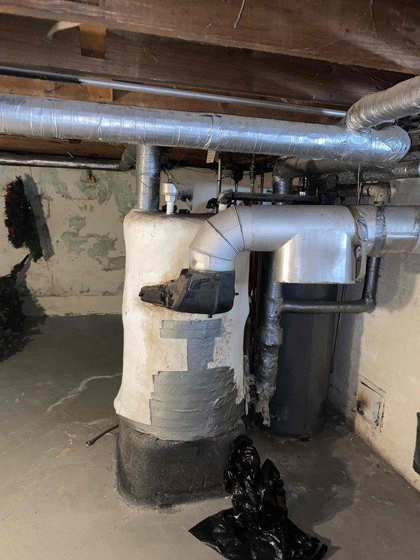Conducted replacement estimate for century-old steam boiler system located in basement. Assessed existing mechanical equipment, electrical service panels, and associated utility infrastructure. Documented current conditions including deteriorated insulation on water heating equipment, aged ductwork, and overall system configuration to provide comprehensive replacement recommendations.