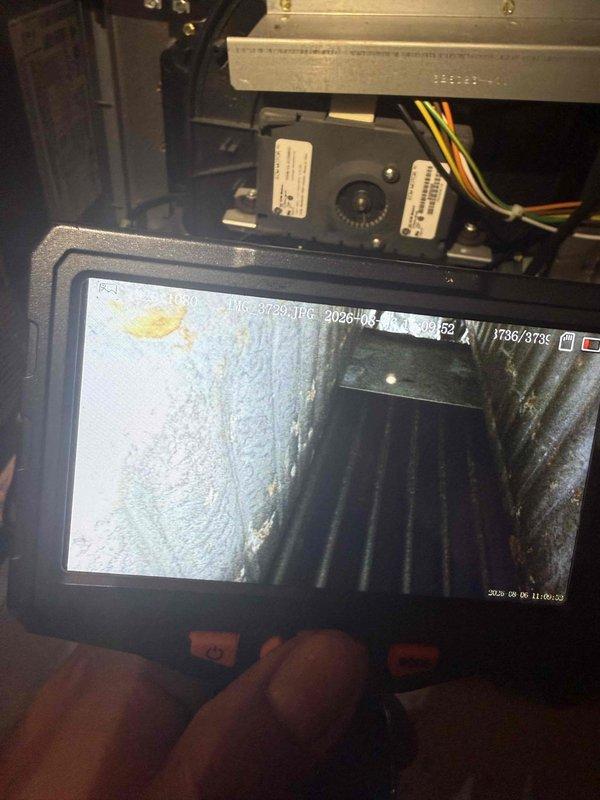 Responded to no-cool call on 16-year-old residential air conditioning system displaying "system malfunction" error on thermostat. Upon arrival, confirmed indoor temperature at 80°F with setpoint of 73°F and no cooling operation throughout home. Performed visual inspection of outdoor condensing unit and indoor air handler components. Utilized digital inspection camera to examine internal ductwork and air handler cabinet, documenting dust accumulation and overall system condition. Verified thermostat malfunction message and system status indicators. Assessed wiring connections at air handler including power and control wiring. Given the age of the equipment and system malfunction indication, provided customer with diagnostic findings and discussed repair versus replacement options for the aging unit. Customer elected to proceed with further evaluation. Documented conditions with photos for service records.