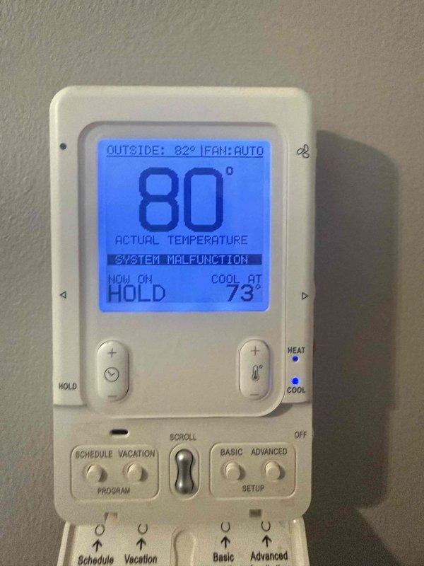 Responded to no-cool call on 16-year-old residential air conditioning system displaying "system malfunction" error on thermostat. Upon arrival, confirmed indoor temperature at 80°F with setpoint of 73°F and no cooling operation throughout home. Performed visual inspection of outdoor condensing unit and indoor air handler components. Utilized digital inspection camera to examine internal ductwork and air handler cabinet, documenting dust accumulation and overall system condition. Verified thermostat malfunction message and system status indicators. Assessed wiring connections at air handler including power and control wiring. Given the age of the equipment and system malfunction indication, provided customer with diagnostic findings and discussed repair versus replacement options for the aging unit. Customer elected to proceed with further evaluation. Documented conditions with photos for service records.