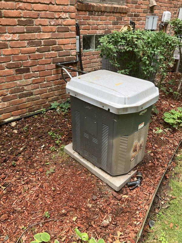 Completed electrical estimate for whole home generator replacement at residential property with existing HVAC equipment. Assessed current outdoor installation area alongside brick building, evaluated electrical service requirements, and determined optimal placement for new generator unit on existing concrete pad. Documented existing electrical conduit routing and site conditions to provide comprehensive replacement proposal for permanent standby power system.