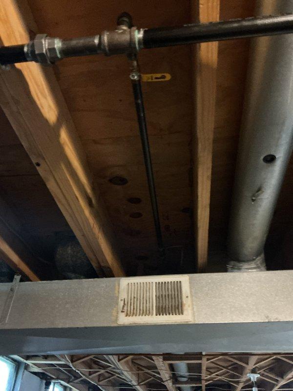 Completed gas line estimate for customer's property. Inspected and photographed existing gas piping system routed through attic space, including black iron pipe with proper support brackets and connections. Evaluated mechanical room area containing HVAC equipment, flexible white tubing, and associated components. Documented current installation conditions including pipe routing, structural penetrations, ventilation ductwork, and equipment placement to provide accurate scope and pricing for proposed gas line work.
