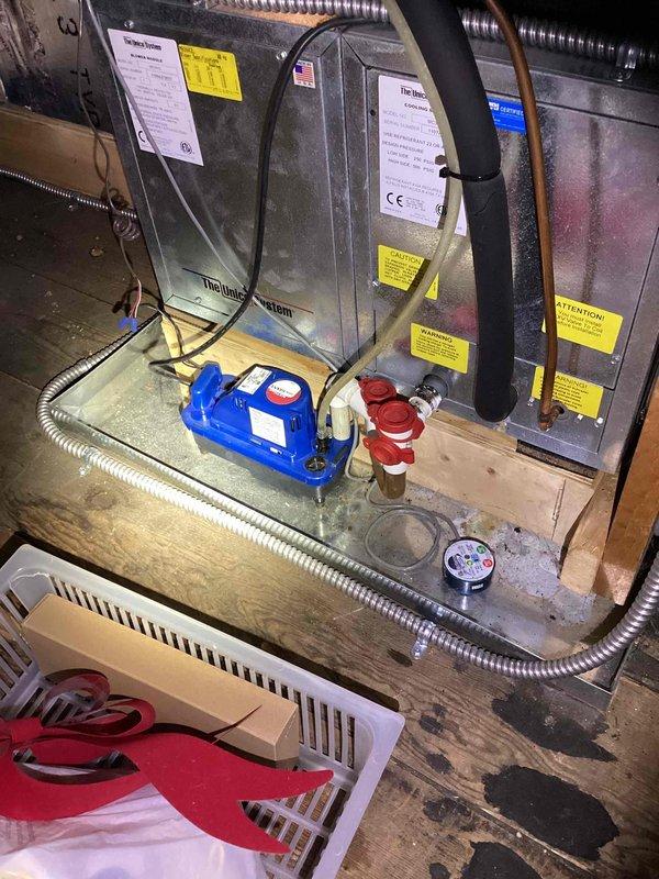 Conducted comprehensive assessment of 10+ year old Unico high-velocity HVAC system located on third level experiencing coolant leak and inadequate cooling performance. Evaluated existing equipment including indoor air handler with condensate management system and outdoor Amana condenser unit, documenting system configuration, refrigerant line routing, electrical connections, and evidence of moisture issues on equipment platform. Prepared full system replacement estimate to address refrigerant leak and restore proper heating and cooling capacity.