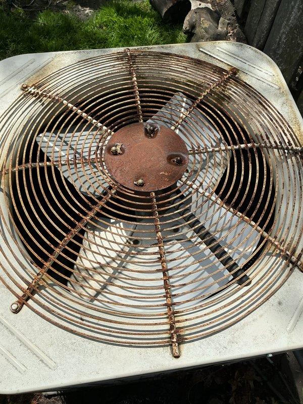 Responded to service call for underperforming and noisy SpacePak system. Conducted comprehensive inspection of outdoor condenser unit, which showed significant rust deterioration on fan guard and weathering on housing components. Documented equipment condition including oxidized fan assembly, weathered cabinet, and copper refrigerant line configuration. Discussed system performance concerns with customer and reviewed available options for addressing noise levels and inadequate heating/cooling capacity.