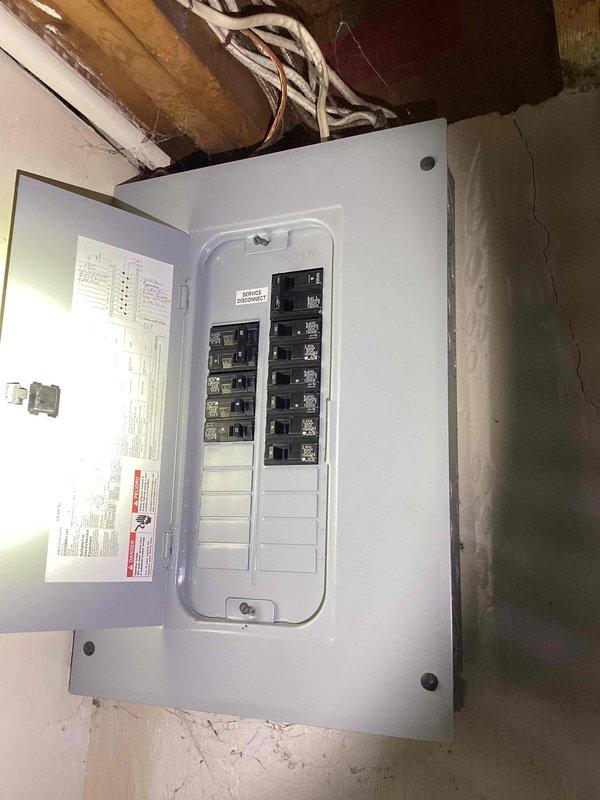 Responded to service call for 25-year-old air conditioning system with condenser unit not discharging warm air properly at outdoor unit. Conducted comprehensive system evaluation of basement-located HVAC equipment including furnace, condenser operation, refrigerant levels, and electrical components. Inspected main electrical service panel and circuit breakers supplying power to HVAC system. Due to advanced age of equipment and operational deficiencies identified during diagnostic assessment, provided full system replacement estimate to address cooling system failure and ensure reliable climate control performance.