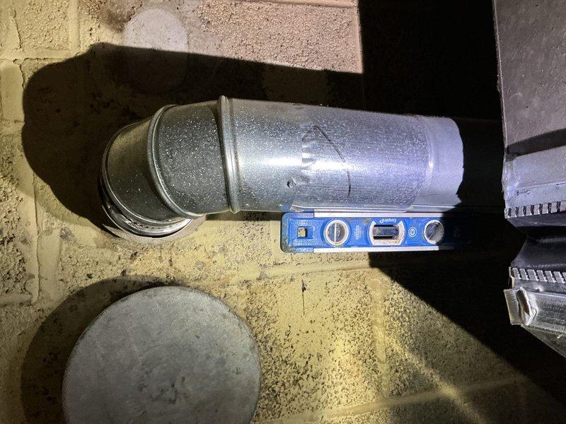 Responded to City of Grosse Pointe Woods code violation regarding improper water heater vent connection slope. Upon inspection, confirmed the hot water tank vent pipe was sloped in the incorrect direction, failing to meet minimum code requirements of 1/4 inch per foot pitch. Disconnected and repositioned the vent connection to ensure proper upward slope away from the A.O. Smith water heater, allowing condensation to drain back toward the appliance and exhaust gases to vent efficiently. Verified correct pitch using level and secured all connections. System tested and brought into compliance with municipal plumbing codes.