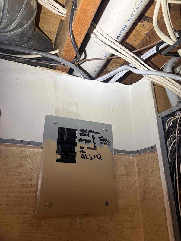 Responded to service call for A/C system evaluation. Upon inspection, identified electrical issue requiring specialist attention at main breaker panel serving AC units 1 and 2. Documented electrical panel conditions with photos showing main breaker box and AC circuit locations. Coordinated with electrical contractor for follow-up service to address breaker concerns and ensure safe system operation.