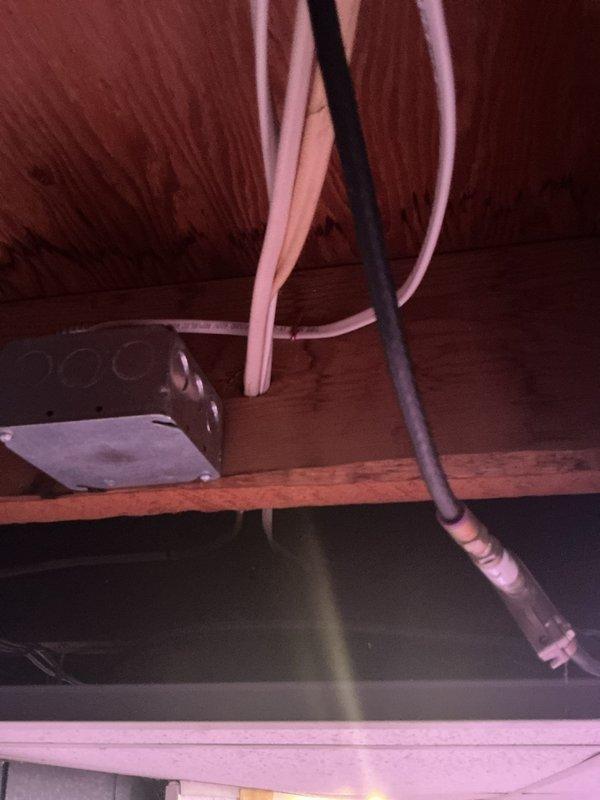 Completed electrical installation warranty addressing multiple code compliance issues. Installed proper size straps for SE cable and seal tight connections, established dedicated circuit for furnace per NEC requirements, and secured low voltage wiring to A/C condensate system. Protected low voltage conductors entering return duct and installed code-compliant protection for NMS cable below joists, ensuring proper securing within 12 inches of all boxes and termination points throughout attic installation.