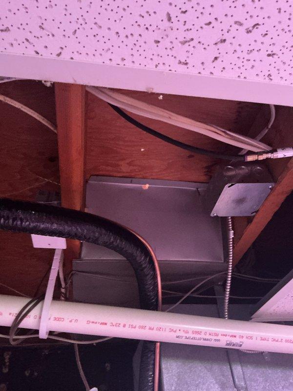 Completed electrical installation warranty addressing multiple code compliance issues. Installed proper size straps for SE cable and seal tight connections, established dedicated circuit for furnace per NEC requirements, and secured low voltage wiring to A/C condensate system. Protected low voltage conductors entering return duct and installed code-compliant protection for NMS cable below joists, ensuring proper securing within 12 inches of all boxes and termination points throughout attic installation.