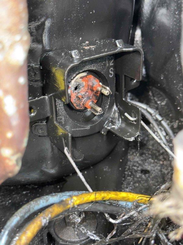 Performed pre-replacement evaluation on 10+ year old cooling system located in basement. Upon inspection, discovered heavily corroded electrical connector with significant oxidation on prongs, creating potential safety hazard and contributing to system malfunction. Inspected blower assembly and found unit operational but showing normal wear consistent with age, with accumulated dust and debris present in housing and ductwork.