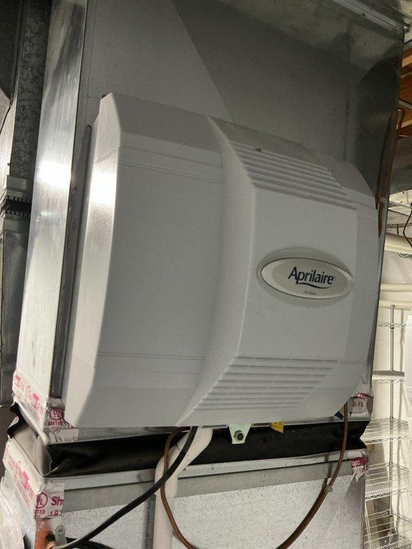 Completed estimate for whole home dehumidification system installation in a 4,400 square foot colonial residence. Assessed existing HVAC infrastructure including galvanized ductwork and current Aprilaire humidifier system in mechanical room to determine optimal integration point for new dehumidification equipment. Documented existing equipment configuration and utility space layout to develop comprehensive installation proposal for whole home dehumidifier that will work in conjunction with current air quality systems.