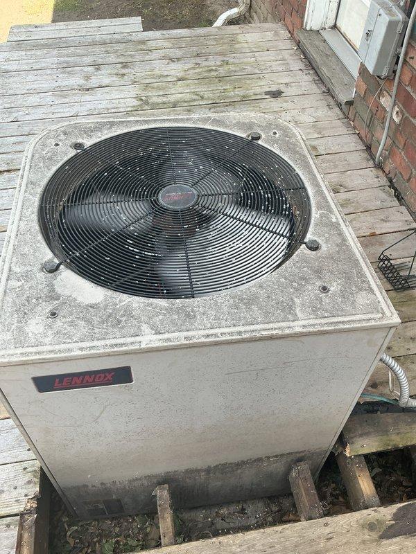 Completed comprehensive tune-up and inspection on Lennox outdoor condensing unit. Performed visual assessment of refrigerant lines, noting aged copper piping with surface discoloration and yellow fiberglass insulation on suction line. Inspected condenser cabinet, fan assembly, and electrical connections. Unit operational at time of service with no immediate repairs required.