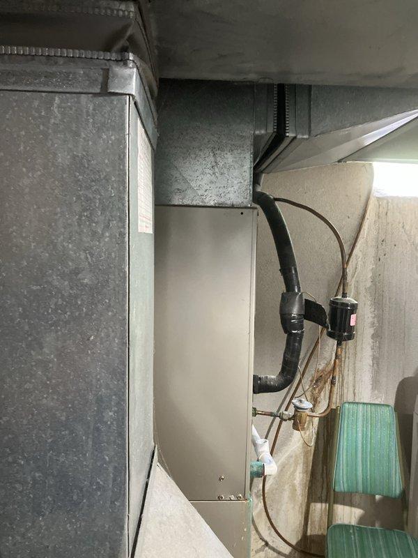 Responded to service call for cooling system evaluation on 10+ year old equipment located in basement mechanical space. Upon inspection, diagnosed failed compressor unit requiring full system replacement rather than individual component repair. Assessed existing air handler, ductwork configuration, and refrigerant line routing. Provided comprehensive full system replacement estimate to homeowner, documenting current equipment condition and recommended replacement specifications for complete HVAC system upgrade.