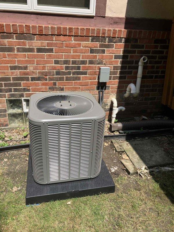 Completed full installation of 2-ton air conditioning system with matching evaporator coil in rear yard location. Installed outdoor condensing unit on concrete pad against building exterior with proper clearances, connected refrigerant lines to new indoor coil mounted on furnace unit in basement. Installed condensate pump and PVC drainage piping to handle system discharge. Reconnected electrical service to both indoor and outdoor components, verified proper voltage and amp draw. Ran and secured dryer gas line piping as requested. All mechanical, electrical, and air conditioning work performed in accordance with code requirements, permit requested for inspection.
