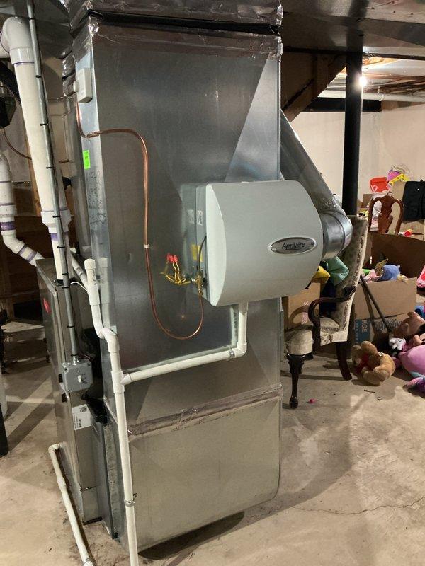 Responded to no cooling complaint on 5-year-old residential AC system located in basement. Upon arrival, found indoor blower motor inoperative and evaporator coil frozen with ice buildup on refrigerant lines. Verified thermostat was calling for cooling and set to 80 degrees. Turned system off to allow coil to thaw completely. Inspected blower motor and found failed capacitor preventing motor operation. Replaced defective capacitor with proper OEM replacement. Once coil fully thawed, tested blower motor operation and confirmed proper airflow across evaporator coil. Checked refrigerant lines for proper insulation and verified no restrictions in ductwork. Cycled system through complete cooling cycle and monitored for proper operation. System restored to normal cooling operation with adequate airflow and no further freezing issues detected.