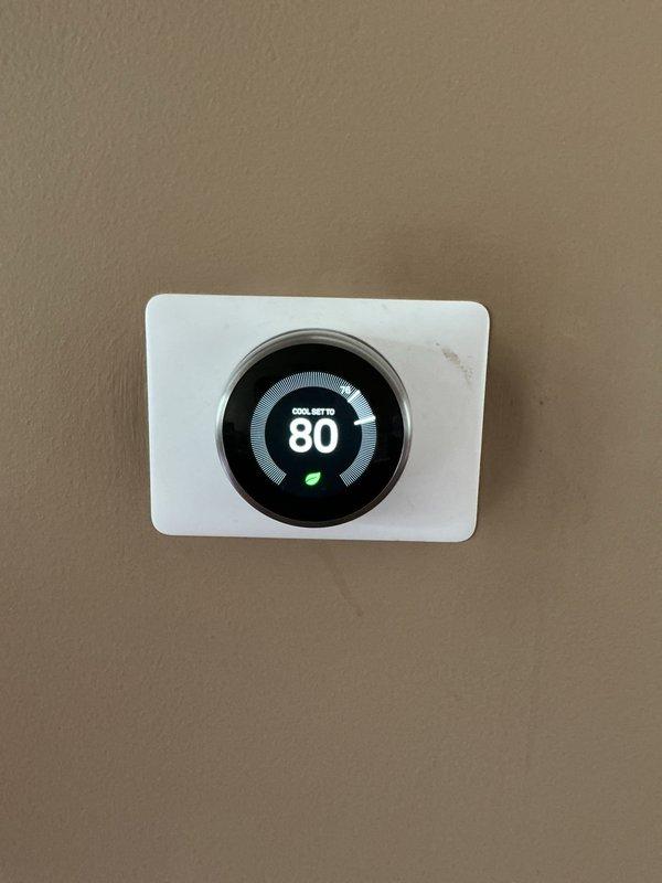 Responded to no cooling complaint on 5-year-old residential AC system located in basement. Upon arrival, found indoor blower motor inoperative and evaporator coil frozen with ice buildup on refrigerant lines. Verified thermostat was calling for cooling and set to 80 degrees. Turned system off to allow coil to thaw completely. Inspected blower motor and found failed capacitor preventing motor operation. Replaced defective capacitor with proper OEM replacement. Once coil fully thawed, tested blower motor operation and confirmed proper airflow across evaporator coil. Checked refrigerant lines for proper insulation and verified no restrictions in ductwork. Cycled system through complete cooling cycle and monitored for proper operation. System restored to normal cooling operation with adequate airflow and no further freezing issues detected.