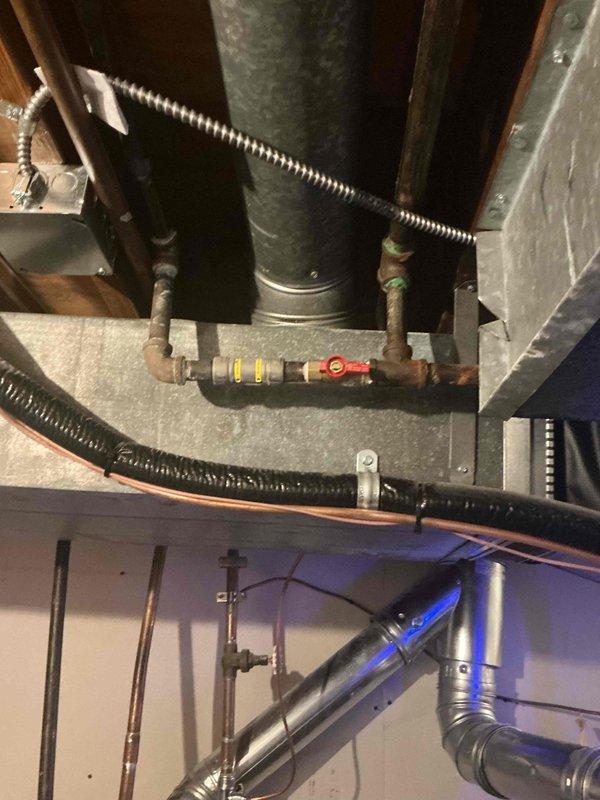 Responded to no-heat call on 2-month-old furnace displaying "waiting for equipment" message in basement location. Performed diagnostic inspection of unit with access panels removed, inspected control board wiring, electrical connections, and internal components. System restored to proper operation with heat confirmed at supply plenum and ductwork.