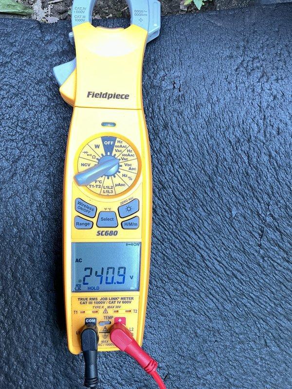 Responded to callback for 6-year-old AC unit in basement that was short-cycling after two previous service visits. Compressor was shutting off after approximately one minute of runtime. Performed diagnostic testing using digital multimeter, measuring line voltage at 240V AC and verifying amperage draw during compressor operation at 7.8 amps. Identified electrical issue causing premature compressor shutdown and corrected the condition to restore normal cooling operation.