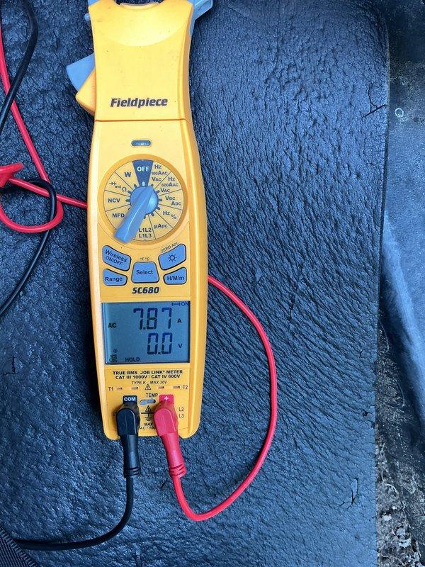 Responded to callback for 6-year-old AC unit in basement that was short-cycling after two previous service visits. Compressor was shutting off after approximately one minute of runtime. Performed diagnostic testing using digital multimeter, measuring line voltage at 240V AC and verifying amperage draw during compressor operation at 7.8 amps. Identified electrical issue causing premature compressor shutdown and corrected the condition to restore normal cooling operation.
