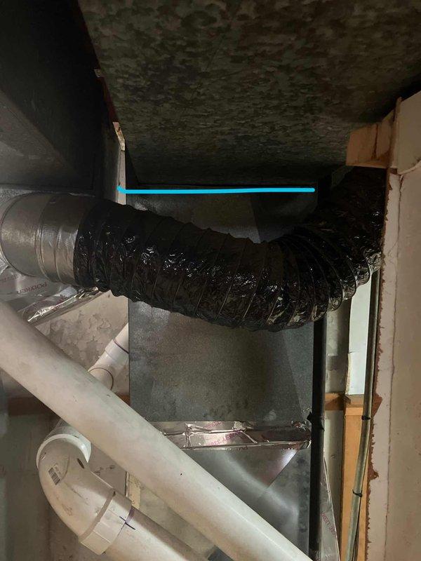 Responded to cooling complaint on 16+ year old air conditioning system not reaching desired temperature despite unit operation. Performed comprehensive assessment of existing HVAC equipment located in basement utility area, including inspection of air handler unit, ductwork configuration, and associated mechanical components. Documented current system condition through detailed photography showing aging equipment, flexible ductwork connections, PVC drainage lines, and overall installation layout to provide accurate replacement estimate for complete system upgrade.