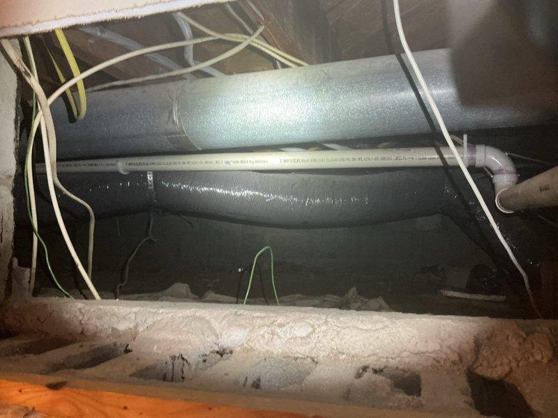 Responded to water intrusion issue with wet carpet in basement. Conducted thorough inspection of crawl space and attic areas, examining HVAC ductwork, plumbing lines, and structural components to identify moisture source. Investigated PVC piping, flexible ductwork connections, and insulated supply lines for signs of leakage or condensation accumulation that could be contributing to the reported water damage.