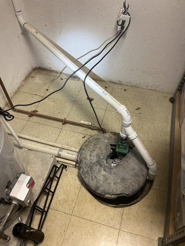 Responded to service call for non-operational sump pump with reported electrical issue. Upon inspection, diagnosed faulty control switch and compromised electrical connections in the pump assembly. Replaced defective gray control unit, secured all electrical wiring, and verified proper pump operation. Tested system through multiple cycles to ensure reliable activation and water discharge through existing PVC discharge piping. System restored to full operational status.