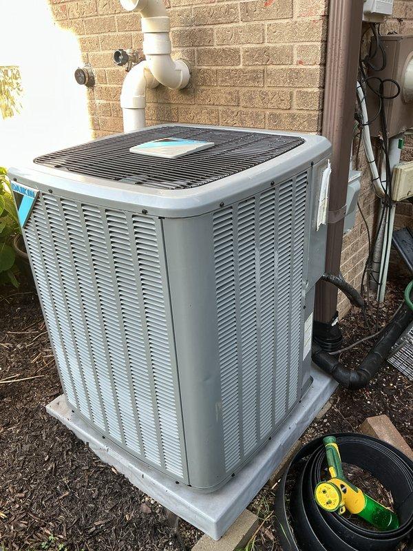Completed comprehensive Gold AC inspection on a 3-4 year old residential air conditioning system. Performed thorough examination of outdoor condenser unit including visual assessment of cabinet condition, refrigerant line connections, and electrical disconnect components. Inspected electrical disconnect box, verified proper fusing, and checked all wiring connections for secure termination. Evaluated condenser coil fins for blockage or damage, assessed unit levelness on concrete pad, and confirmed proper drainage. Examined basement-located air handler and mini-split components, with particular attention to HEPA filter condition and replacement procedures. Verified system operational status, checked refrigerant pressures, and ensured all safety controls functioning properly. Unit operating within normal parameters with no immediate service concerns identified.