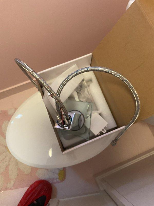 Responded to bathroom faucet installation request at 1976-built residential property. Assessed existing granite countertop opening to determine feasibility of enlargement for new fixture installation. Evaluated mounting configuration and verified compatibility with single-hole installation requirements on marbled countertop surface, documenting existing conditions and fixture specifications for estimate purposes.