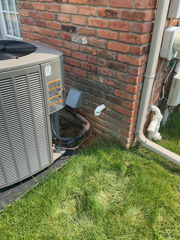 Completed plumbing repair service at residential property where customer enrolled in Gold Plan membership, receiving applicable discount on total repair cost. Inspected and serviced plumbing infrastructure in attic utility space, including copper water supply lines and white PVC drainage system mounted near HVAC electrical disconnect panel. Evaluated exterior plumbing connections associated with air conditioning condenser unit, including condensate drainage line and PVC piping with insulation wrap mounted to exterior brick wall, ensuring proper drainage function and system integration.