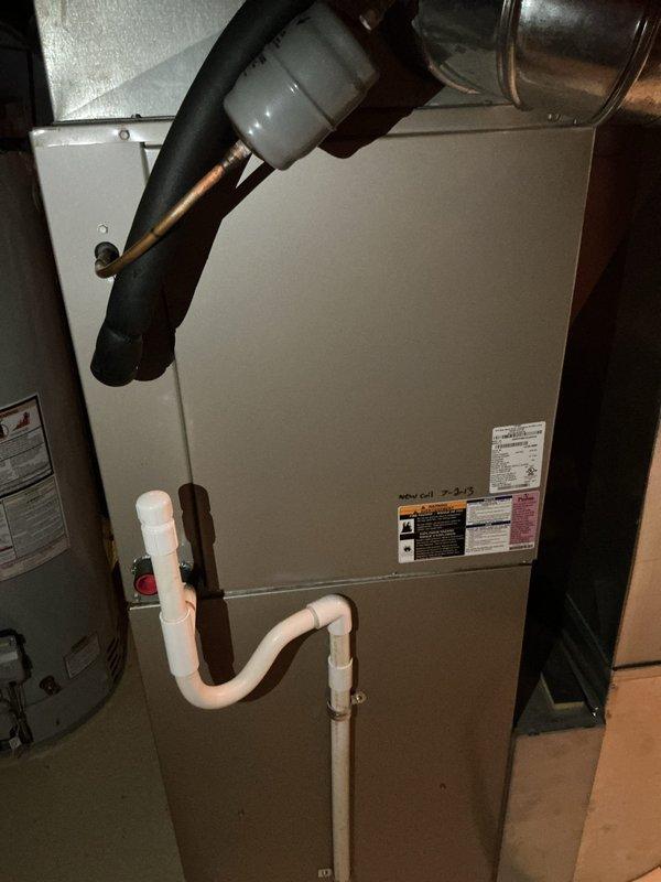 Responded to no cooling call on 20-year-old residential air conditioning system. Upon arrival, performed complete system evaluation including inspection of outdoor condensing unit located behind residence and indoor air handler unit in basement. Verified thermostat programming and settings on White-Rodgers programmable unit. Assessed refrigerant lines, condensate drain system with PVC piping, electrical connections, and ductwork configuration. System evaluation completed with diagnostic findings documented. Customer educated on system age and provided recommendations for aging equipment. Call completed with overview of system condition.