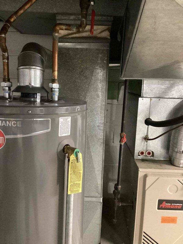 Responded to service call for non-operational air conditioning system at residential property. Upon inspection, identified R-22 refrigerant system with low charge levels affecting both outdoor condenser unit located in backyard and indoor Amana air handler in basement. Due to age of equipment, refrigerant type, and system condition, provided comprehensive estimate for complete HVAC system replacement including new outdoor condensing unit and compatible indoor equipment.