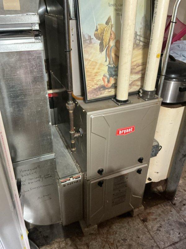 Completed comprehensive tune-up and inspection on 12-year-old Bryant furnace system located in basement. Performed standard maintenance procedures including filter inspection, burner examination, heat exchanger evaluation, blower motor assessment, and safety control verification. All system components found operating within normal parameters with no immediate service concerns identified.