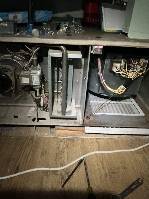 Completed comprehensive tune-up and safety inspection on two 18-year-old furnace units located in attic and crawl space. Performed full system diagnostics including visual inspection of heat exchanger, burner assembly, and blower motor components. Checked electrical connections, tested safety controls, and verified proper operation of all system components. Inspected condensate drain lines and refrigerant connections for leaks or deterioration. Evaluated blower motor performance and examined wiring harnesses for signs of wear or damage. Both units operational and passed safety inspection upon completion of service.