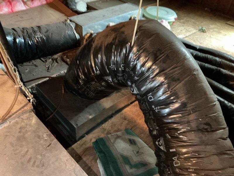 Responded to service call for non-functioning air conditioning system with no cooling throughout property. Accessed attic-mounted HVAC system through side entry and performed comprehensive assessment of existing air handler unit, flexible ductwork, and associated components. Documented current system condition including aged equipment, black flexible duct routing, insulation status, and overall installation configuration. Provided detailed replacement estimate for complete air conditioning system upgrade to restore cooling functionality.