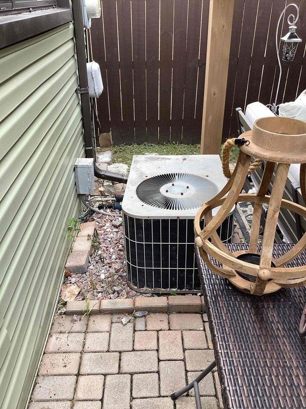 Conducted comprehensive assessment for complete HVAC system replacement including furnace and central air conditioning. Evaluated existing air conditioning condenser unit located on exterior concrete pad with electrical disconnect, noting unit condition and installation configuration. Inspected basement furnace installation and existing thermostat requiring replacement. Documented equipment specifications, measured system capacities, assessed ductwork accessibility, and provided detailed replacement recommendations for both heating and cooling components to ensure proper system sizing and optimal performance.
