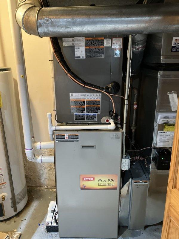 Successfully completed installation of 4-ton Lennox air conditioning condenser unit in rear yard with matching evaporator coil system. Unit positioned on rubber pad in side yard area with proper clearances maintained, connected to existing Bryant Plus 95s furnace system via new refrigerant lines. All electrical connections completed with conduit installation, refrigerant lines properly insulated and routed, condensate drainage verified operational. System tested, charged to manufacturer specifications, and confirmed operational with all safety controls functioning properly.