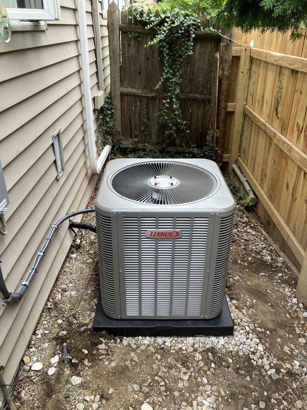 Successfully completed installation of 4-ton Lennox air conditioning condenser unit in rear yard with matching evaporator coil system. Unit positioned on rubber pad in side yard area with proper clearances maintained, connected to existing Bryant Plus 95s furnace system via new refrigerant lines. All electrical connections completed with conduit installation, refrigerant lines properly insulated and routed, condensate drainage verified operational. System tested, charged to manufacturer specifications, and confirmed operational with all safety controls functioning properly.