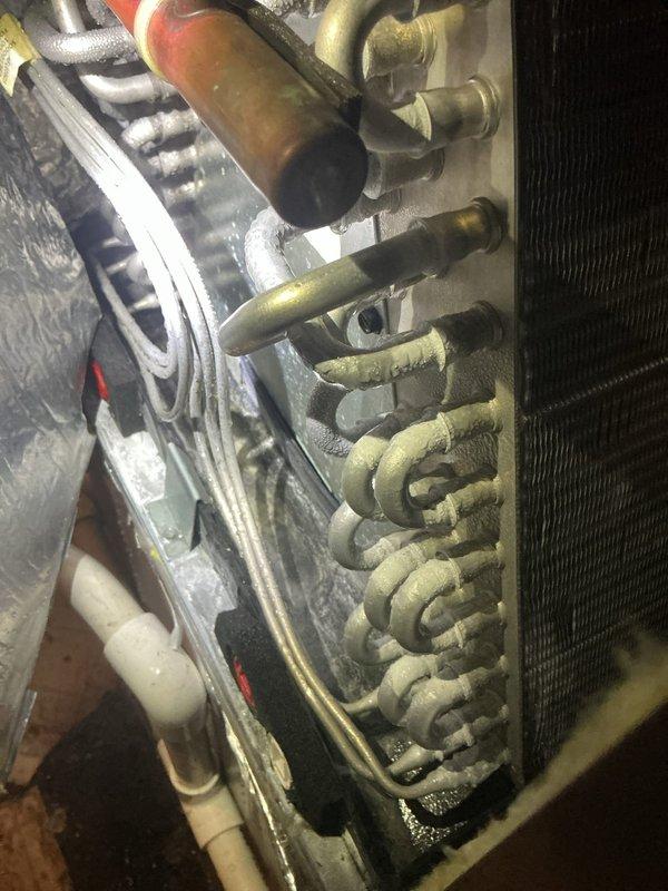 Responded to service call for furnace leaking when air conditioning system is running. Upon inspection, identified condensate drainage issue related to evaporator coil. Found significant dust and debris accumulation on evaporator coil fins, restricting airflow and causing excessive condensation. Inspected PVC condensate drain line and connections for proper pitch and flow. Cleaned evaporator coil to restore proper heat transfer and drainage. Verified condensate drain line is clear and draining properly. Tested system operation to confirm leak has been resolved and unit is functioning within manufacturer specifications.