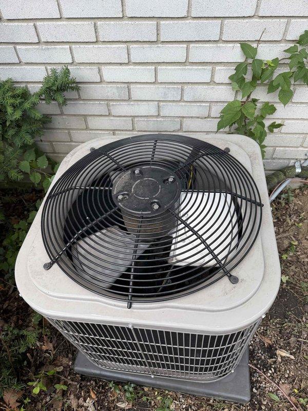Returned to property to address ongoing cooling issue with outdoor condensing unit. Replaced defective plug switch combo that was preventing proper unit operation. Upon inspection, noted significant moss and algae accumulation on refrigerant lines indicating prolonged moisture exposure and need for routine maintenance. Verified electrical connections secure and tested unit operation after component replacement. System now cycling properly and cooling effectively. Recommended regular maintenance to prevent future biological growth on exterior components and ensure optimal performance.