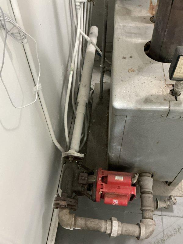 Performed boiler inspection on approximately 10-year-old unit located in laundry room on main floor. Upon testing, detected high carbon monoxide levels and immediately shut down boiler for safety. Documented existing system including circulation pump, piping configuration, and water heater assembly. Provided estimate for necessary repairs or replacement to address dangerous CO condition and restore safe heating operation.