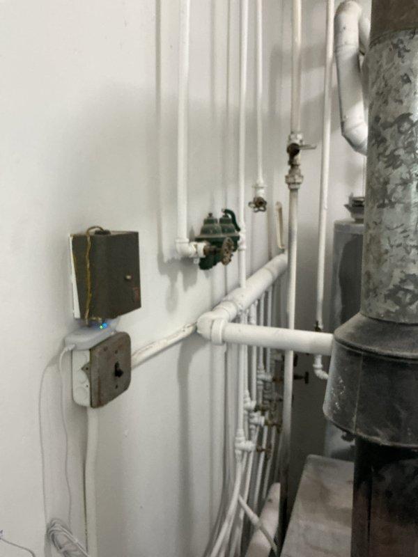 Performed boiler inspection on approximately 10-year-old unit located in laundry room on main floor. Upon testing, detected high carbon monoxide levels and immediately shut down boiler for safety. Documented existing system including circulation pump, piping configuration, and water heater assembly. Provided estimate for necessary repairs or replacement to address dangerous CO condition and restore safe heating operation.
