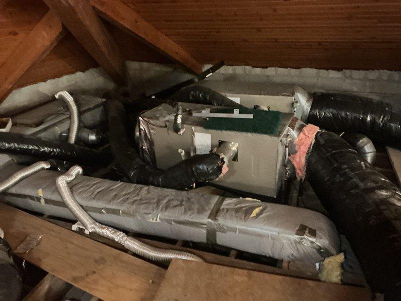 Responded to no cooling complaint at commercial church facility with six AC units located on second level. Diagnosed non-operational condenser fan motor and faulty thermostat as primary causes of system failure. Inspected air handler units and ductwork in attic and basement spaces, verifying proper airflow pathways and insulation integrity. Replaced defective condenser fan motor and installed new thermostat to restore cooling capacity. Tested all six units for proper operation, confirmed adequate refrigerant levels, and verified electrical connections throughout system. All units returned to normal cooling operation upon completion of repairs.
