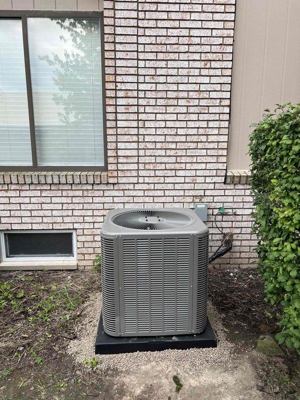 Completed installation of 2.5-ton Lennox air conditioning system with matching evaporator coil at residential property. Unit was positioned in rear yard location on composite mounting pad, with electrical disconnect installed on adjacent brick wall and proper conduit routing. System was reconnected to existing mechanical infrastructure per permit specifications, tested for proper operation, and left in full working condition.