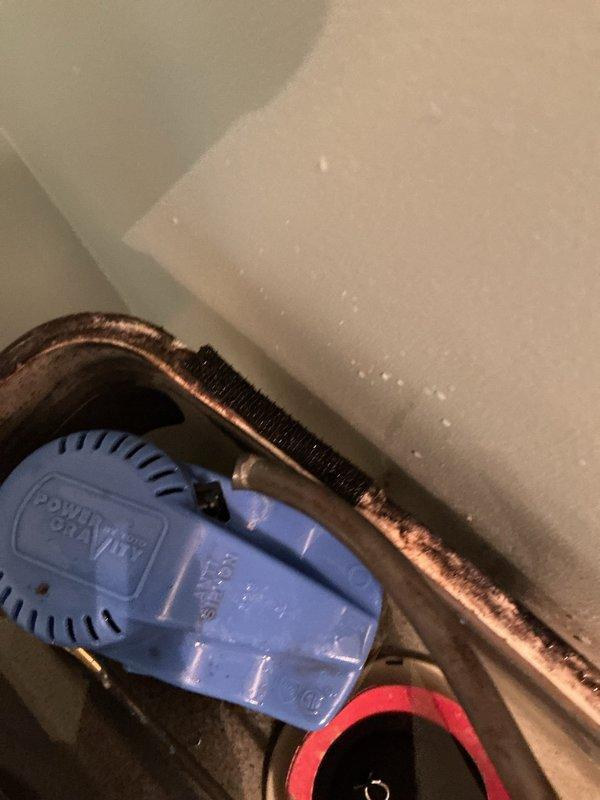 Responded to a water leak at the base of a main floor toilet in a thirty-year-old home. Upon inspection, found the leak had been ongoing for two days and was isolated to a single black one-piece toilet installed on ceramic tile flooring. Assessed the wax ring seal and flange connection as the likely source of the leak. Removed and reset the toilet, replaced the wax ring seal, inspected the closet flange for damage or deterioration, and secured all mounting bolts to proper torque specifications. Tested the toilet for proper operation and verified no further leakage at the base. Documented the completed repair with photographs showing the toilet installation and surrounding bathroom area.