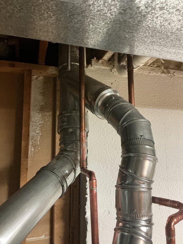 Successfully removed and replaced an existing 75-gallon residential water heater with a new 50-gallon unit in the basement utility area. The installation included disconnecting and capping the existing copper supply lines, removing the old unit, and installing the new water heater with proper venting connections to the existing ductwork system. All plumbing connections were secured with appropriate fittings and the unit was tested for proper operation. Additionally, repaired a loose sink stopper assembly on the basement bathroom sink, restoring full functionality to the drain mechanism.